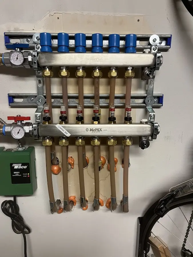 Plumber performing Water Heater Repair at a residential property in New Richmond